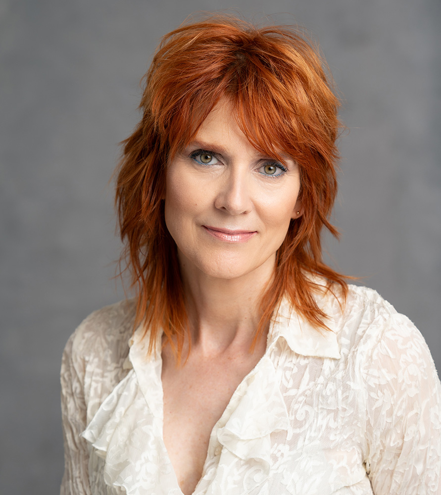 Actor and voiceover actor Elizabeth LaPrade headshot wearing a cream colored blouse